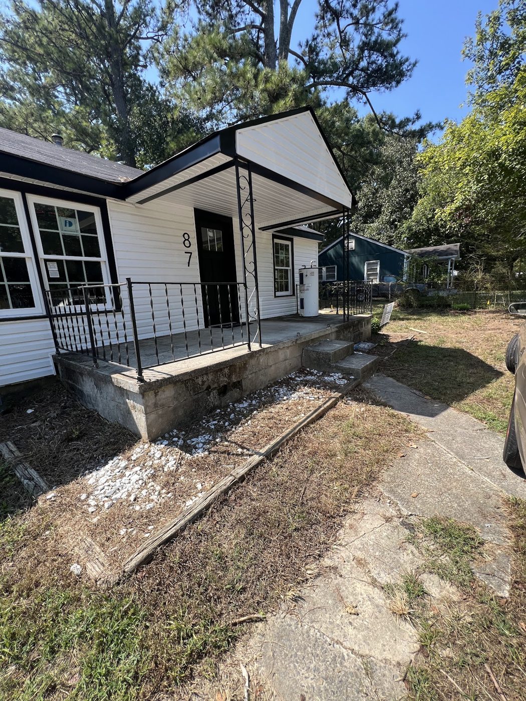 Front porch with metal railing